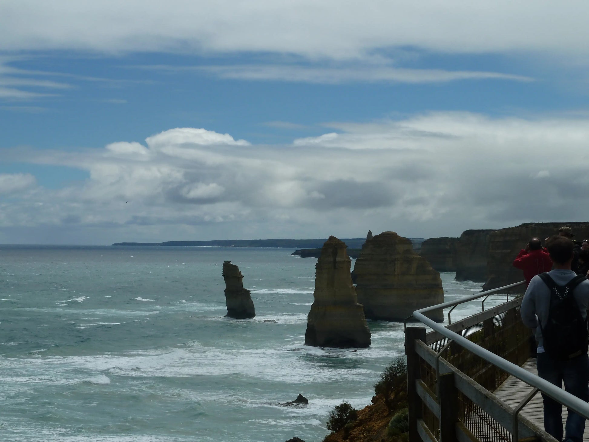 The Twelve Apostles viewing area boardwalk overlooking the limestone stacks in Victoria, Australia.