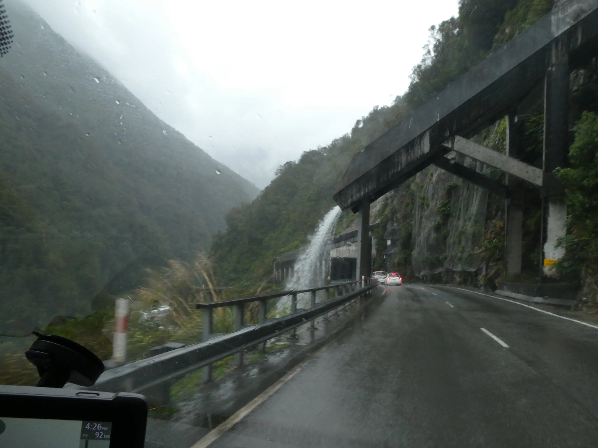 Driving through Arthur's Pass and the Otira Viaduct in the rain, South Island, New Zealand.