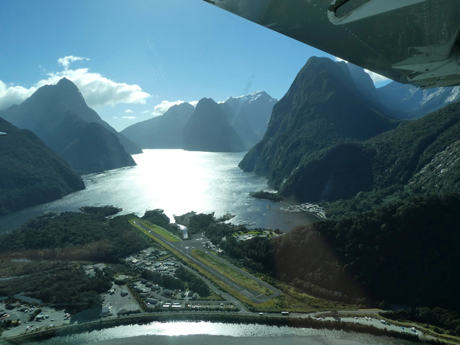 Aerial photography of Milford Sound Airport and Mitre Peak, Fiordland National Park, New Zealand.