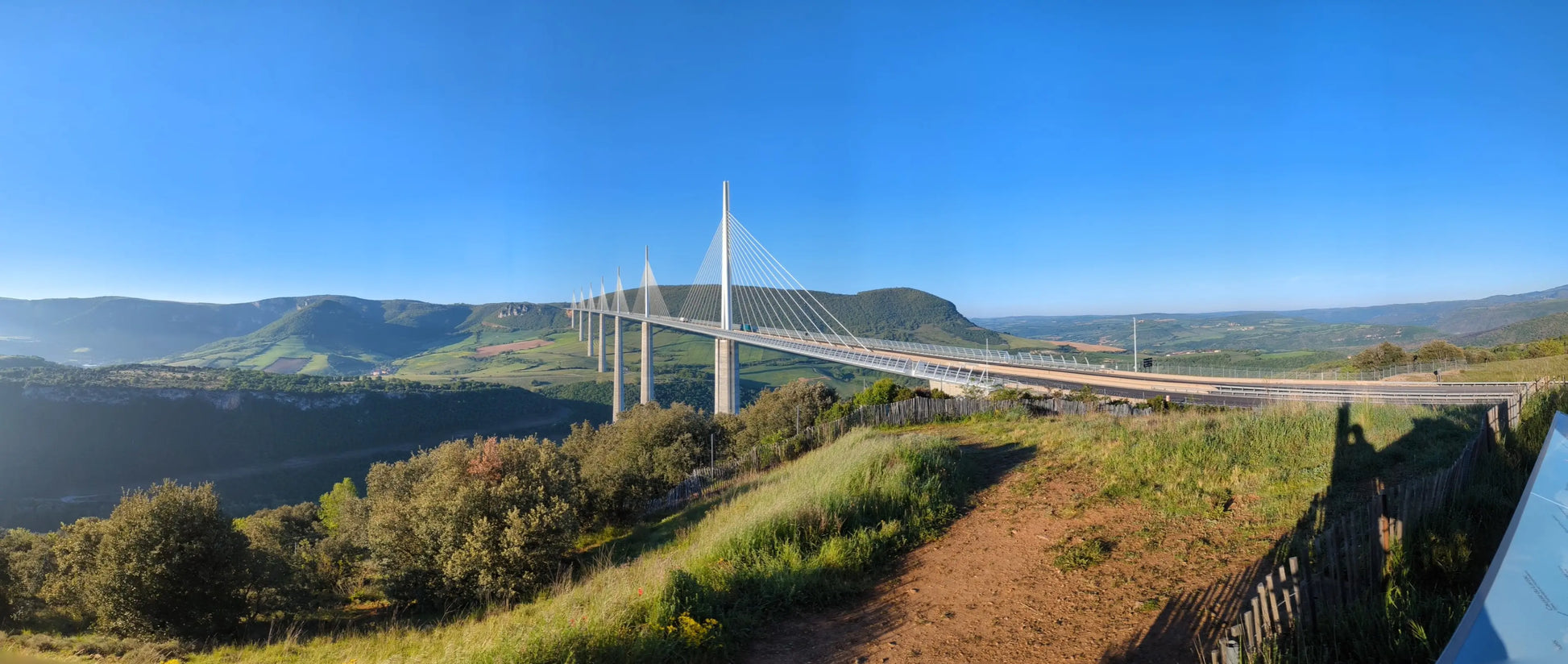 A breathtaking panoramic view of the Millau Viaduct in Southern France, the world’s tallest bridge, as seen from the official visitor viewing point.